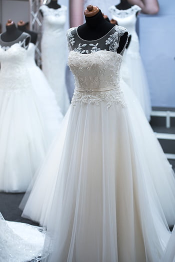 Showcasing elegant wedding dresses on mannequins, perfect for bridal fashion shows. HD phone wallpaper