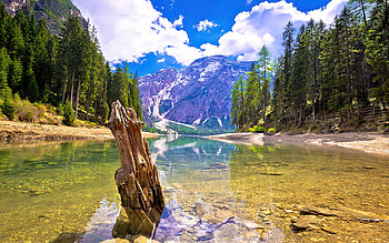 Idyllic lake in Dolomites, Lago di Braies, South Tyrol, landscape, trees, clouds, italy, sky, alps, mountains HD wallpaper
