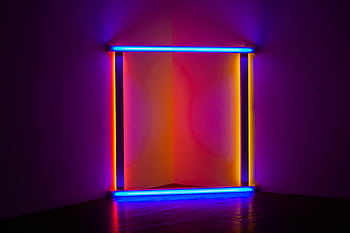 Colorful neon light installation creating a modern abstract art piece in an indoor gallery setting. HD wallpaper