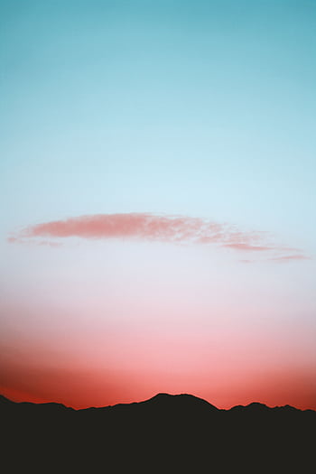 A calming view of mountains under a vibrant twilight sky, perfect for use. HD phone wallpaper