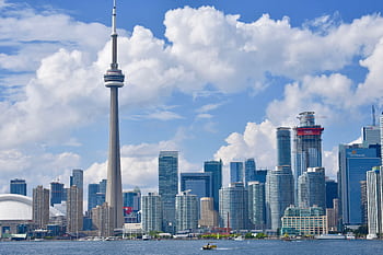 Beautiful view of Toronto's skyline showcasing the iconic CN Tower and waterfront. HD wallpaper