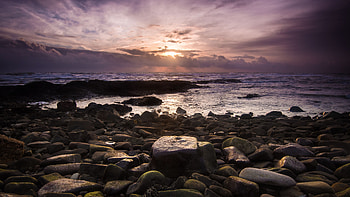 Stones Ocean Waves Under Black White Clouds Sky During Sunset Nature HD wallpaper