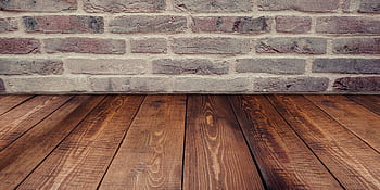 Stylish vintage brick wall background complemented by a rustic wooden floor. HD wallpaper