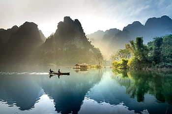 Tranquil lake with mountains reflecting at sunrise in Tuyên Quang, Vietnam. HD wallpaper