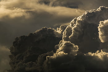 A powerful of dark, dramatic clouds under a moody sky. HD wallpaper