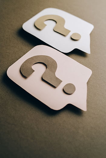 Two paper craft question marks on speech bubbles create a conceptual visual. HD phone wallpaper