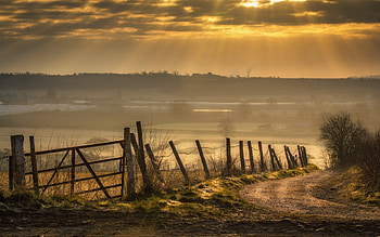 wonderful sunbeams over the valley, valley, field, fence, clouds, sunbeams, road HD wallpaper