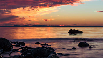 Stones Sea Waves Rocks Mountains Under Blue Sky During Sunset Nature HD wallpaper