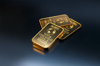 Close-up of gold bars on a dark background, representing wealth and investment opportunities. HD wallpaper