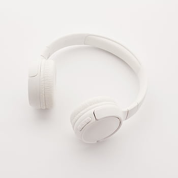 Sleek overhead view of modern white wireless heads on a clean white background. HD phone wallpaper