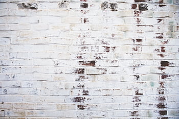 A high-resolution of a white painted brick wall with weathered texture. HD wallpaper
