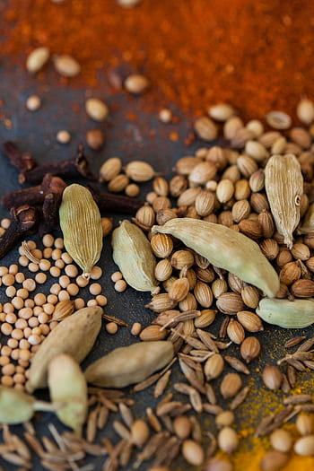 A vibrant close-up of assorted whole spices, perfect for cooking and culinary inspiration. HD phone wallpaper