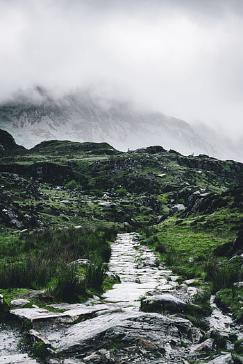 A scenic misty mountain pathway in Wales, perfect for hiking and nature exploration. HD phone wallpaper