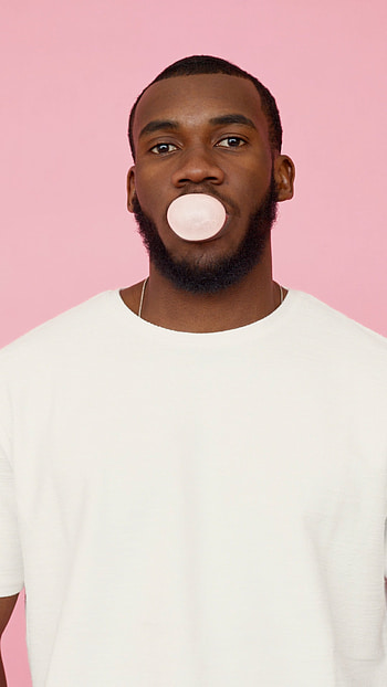 Man blowing bubble gum, Fun and entertaining, Bubble-blowing amazement, Playful enjoyment HD phone wallpaper