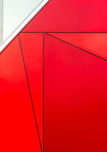 Abstract red geometric facade with triangular patterns and cladding in a contemporary design. HD phone wallpaper