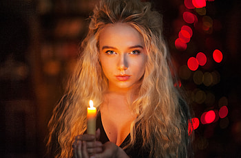 Woman with candle, bokeh HD wallpaper
