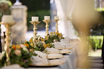 Luxurious outdoor wedding table setting with flowers and candlesticks. HD wallpaper