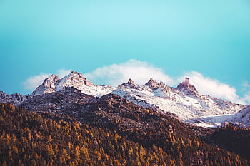 Capture of snow-capped mountains in the Swiss Alps under a clear blue sky. HD wallpaper