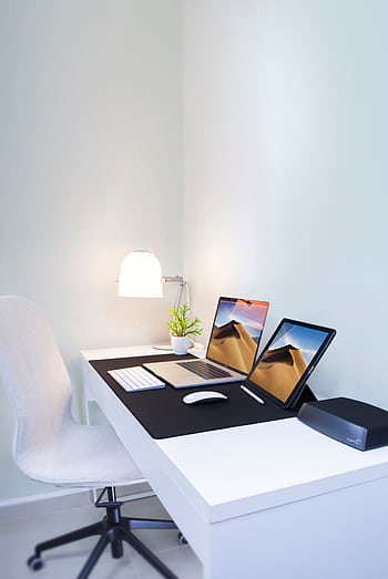 Stylish home office desk with dual screens and minimalist decor. Perfect for remote work and productivity. HD phone wallpaper