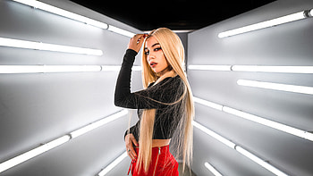 Ava Max Girl Model Is Standing In White Lights Background Wearing Black Top And Red Pants Girls HD wallpaper