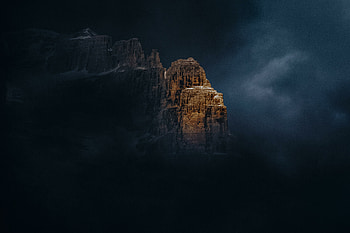 Cloudy sky, shining summit, mountains HD wallpaper