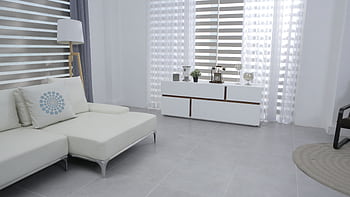 Bright and spacious living room featuring modern minimalist decor, a white sofa, and sleek furniture. HD wallpaper