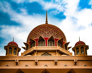 Stunning view of Putra Mosque's domes against a bright sky, showcasing Islamic architecture. HD wallpaper