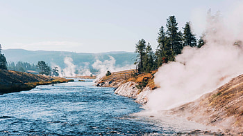 Early morning steam wafting from Yellowstone's geysers, Wyoming, trees, sky, rocks, usa HD wallpaper