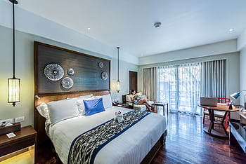 Contemporary hotel room interior design with cozy elegance and modern furnishings. HD wallpaper