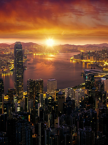 Hong Kong cityscape, Sunrise glow, City lights, Skyline view HD phone wallpaper