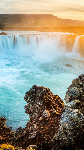 Sunset waterfall, Captivating moment, Mesmerizing beauty, Natural wonder HD phone wallpaper