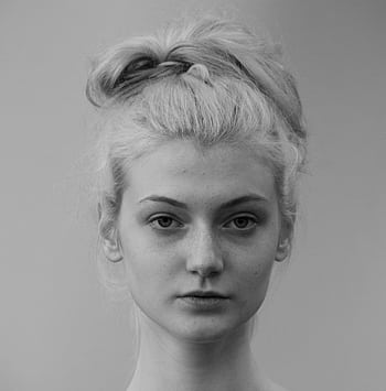Captivating black and white portrait of a young woman with natural hair. HD phone wallpaper
