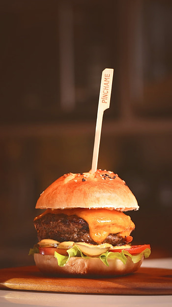 Juicy beef patty, Tasty cheese melt, Sesame seed bun, Savory condiments HD phone wallpaper