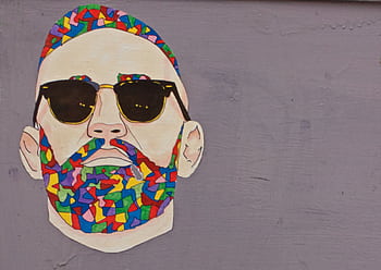 Abstract street art portrait of a man with colorful beard and sunglasses on a grey wall. HD wallpaper