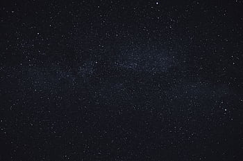A deep and expansive view of a starry night sky, capturing the beauty of the galaxy. HD wallpaper
