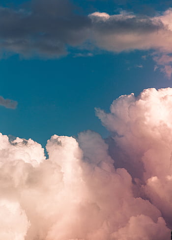 Stunning cumulus clouds fill the sky, offering a dreamy and peaceful atmosphere. HD phone wallpaper