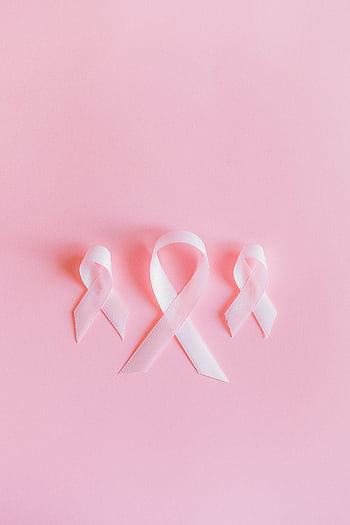Three pink ribbons symbolize breast cancer awareness on a light pink background. HD phone wallpaper