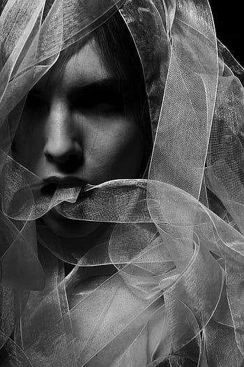 Monochrome portrait of a young woman with a veil, creating a mysterious atmosphere. HD phone wallpaper