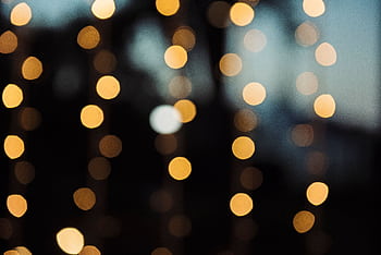A warm and abstract defocused background with circular bokeh lights. HD wallpaper