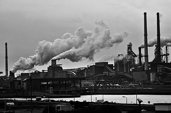 A black and white view of the industrial area in Rotterdam with smoke emissions. HD wallpaper