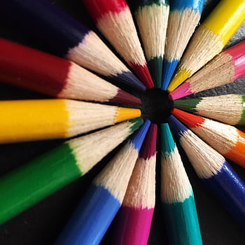 Colorful arrangement of pencils forming a circular pattern, showcasing artistic creativity. HD phone wallpaper
