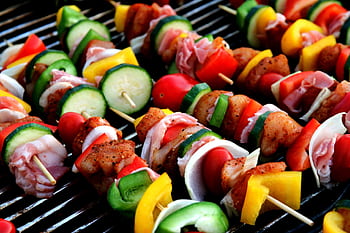 Freshly grilled colorful skewers with mixed vegetables and meat, perfect for a summer barbecue. HD wallpaper