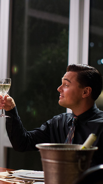 The Wolf of Wall Street movie, Captivating storytelling, High-rolling lifestyle, Wall Street frenzy HD phone wallpaper