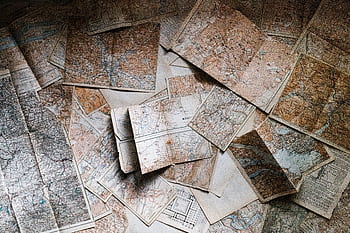 A collection of vintage maps scattered for exploring world journeys and discoveries. HD wallpaper