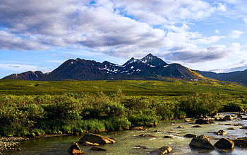 Jagged mountains tower over the remote Caribou Cry River, Mackenzie Mountains, NWT, clouds, landscape, sky, canada, mountains, stones HD wallpaper