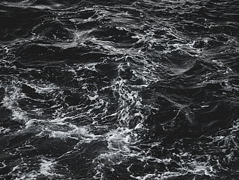 Monochrome of turbulent ocean waves showing intricate textures and movement. HD wallpaper