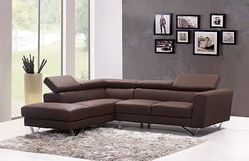 Contemporary living room featuring a stylish brown sectional sofa and artistic wall frames. HD wallpaper