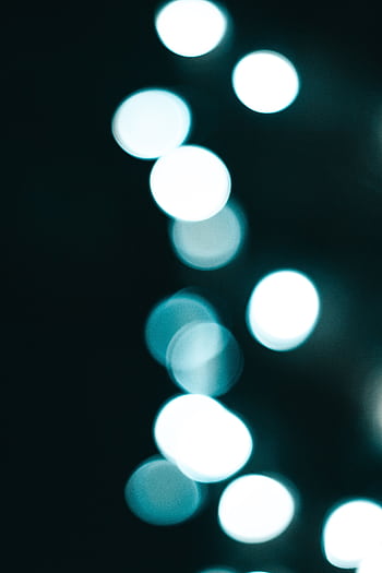 Blue-hued abstract bokeh lights creating an enchanting and serene atmosphere. HD phone wallpaper