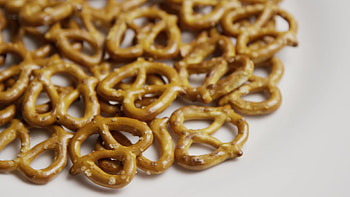 Rotating pretzels, White plate, Delicious appetizer, Stock video footage HD wallpaper
