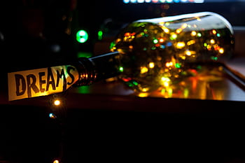 A vibrant, conceptual showcasing a dream theme with illuminated fairy lights in a bottle. HD wallpaper
